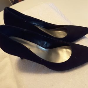 Black suede pumps.